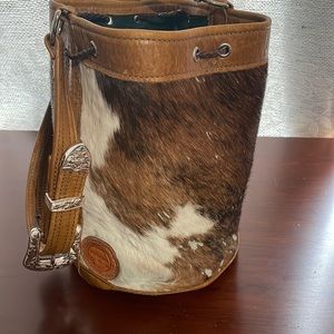 Cowhide drawstring bucket bag